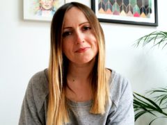Portrait of a member of staff, female in front of Freida Kahlo image